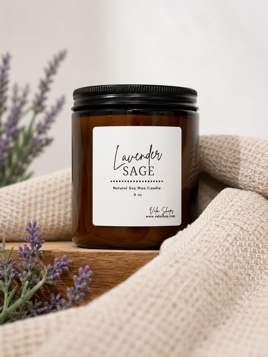 Sage + Lavender soy wax candle in a stylish glass container, perfect for home decor styling.