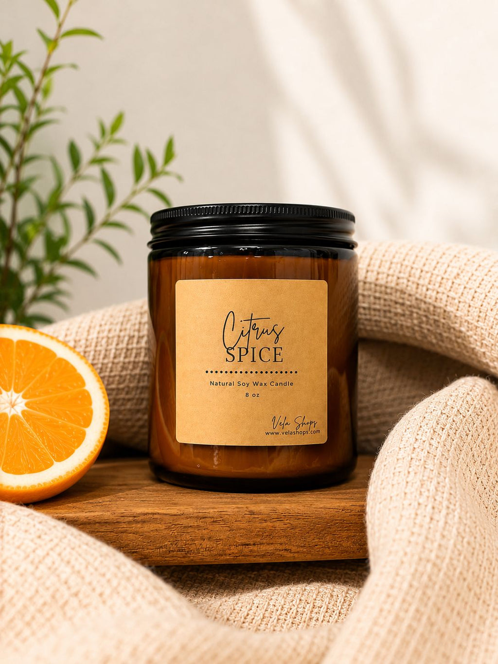 Citrus Spice soy wax candle in glass jar with amber and tan label design.