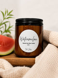 A minimalist brown and black jar holding an 8oz watermelon scented natural soy wax candle.