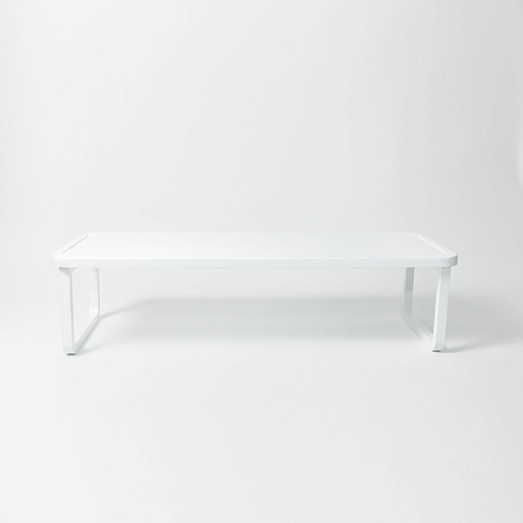 A white stackable wooden shoe shelf on a white background with dimension annotations