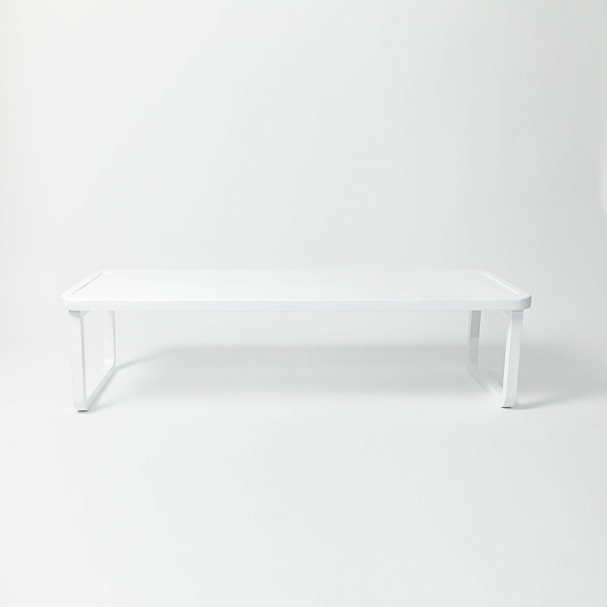 A white stackable wooden shoe shelf on a white background with dimension annotations