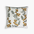 Ziva throw pillow cover in cotton velvet with intricate yellow floral embroidery.