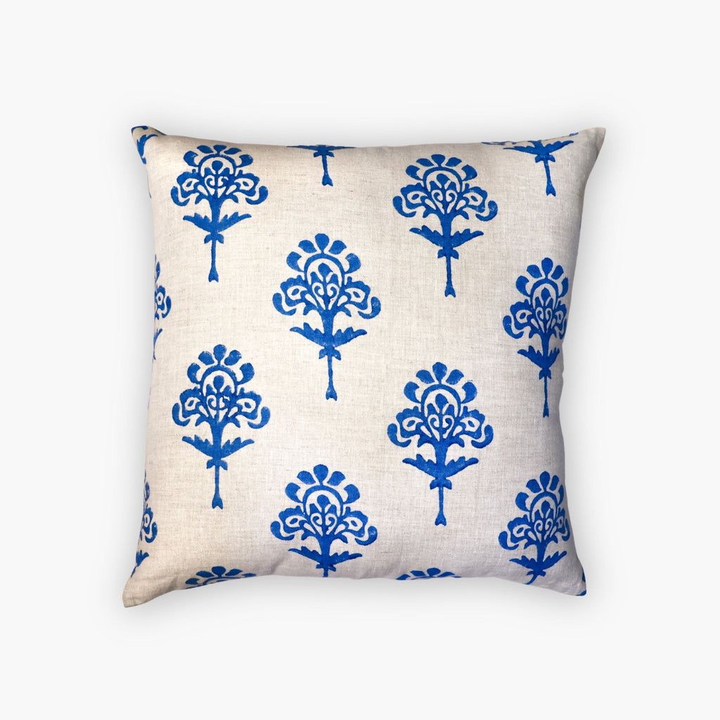 Blue Harmony artisan linen throw pillow cover with hand-block printed details on a stylish chair.