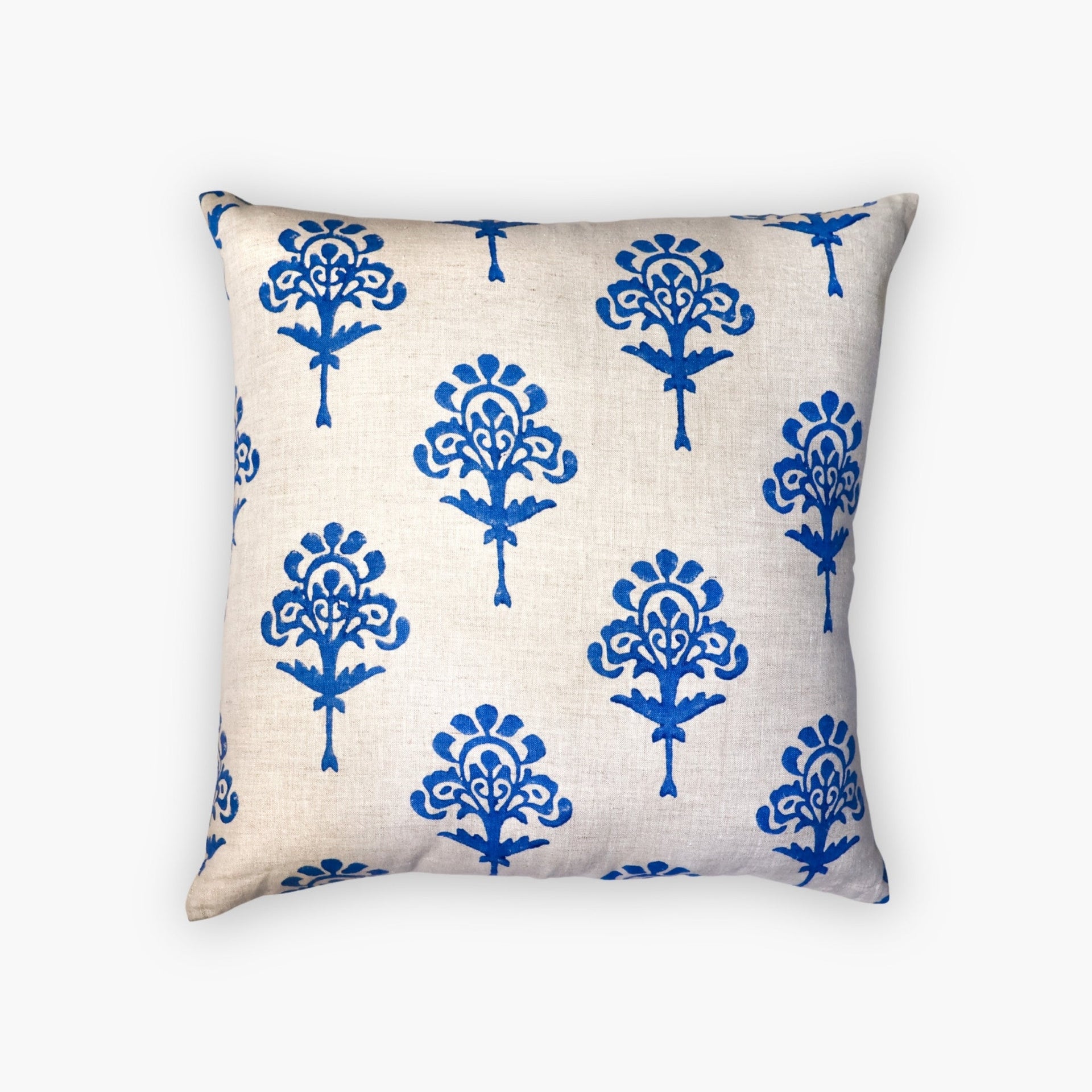 Blue Harmony artisan linen throw pillow cover with hand-block printed details on a stylish chair.