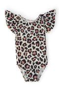A toddler girl wearing a Wild One leopard print flutter sleeve leotard and a black tulle skirt in a ballet pose.