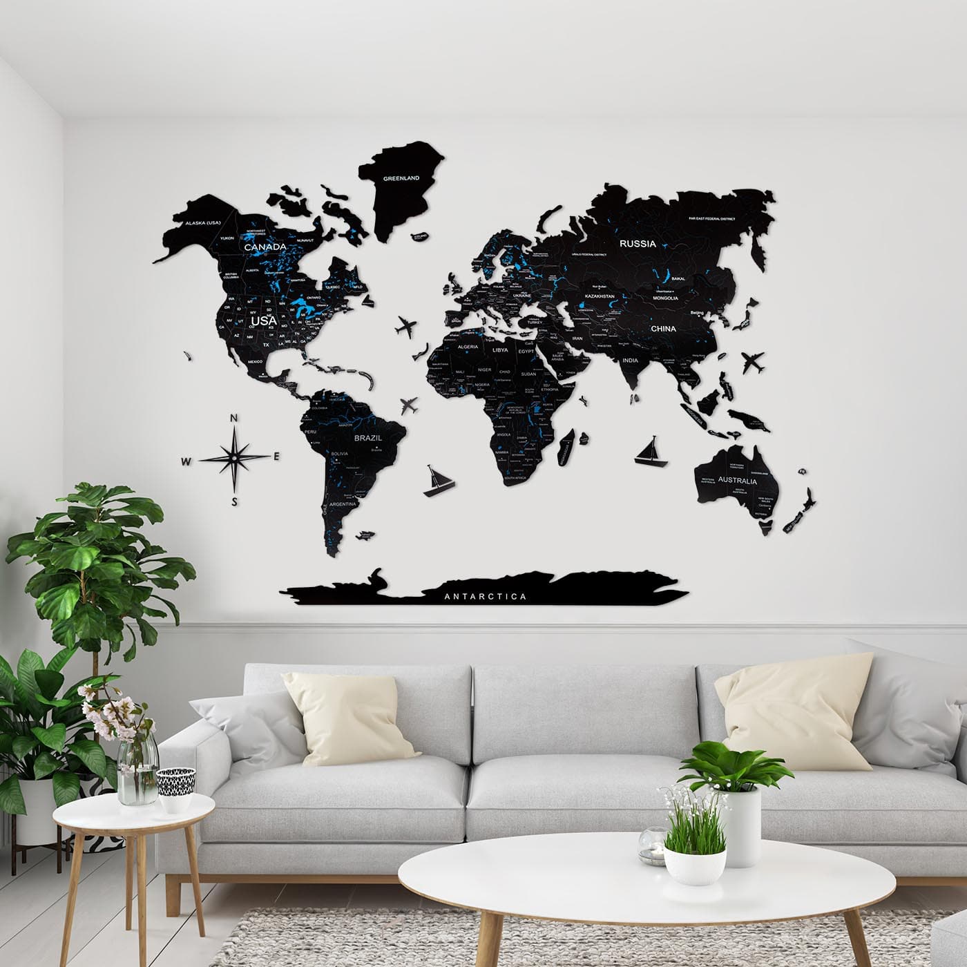 Handcrafted black wooden world map wall art with wooden planes and compass detail