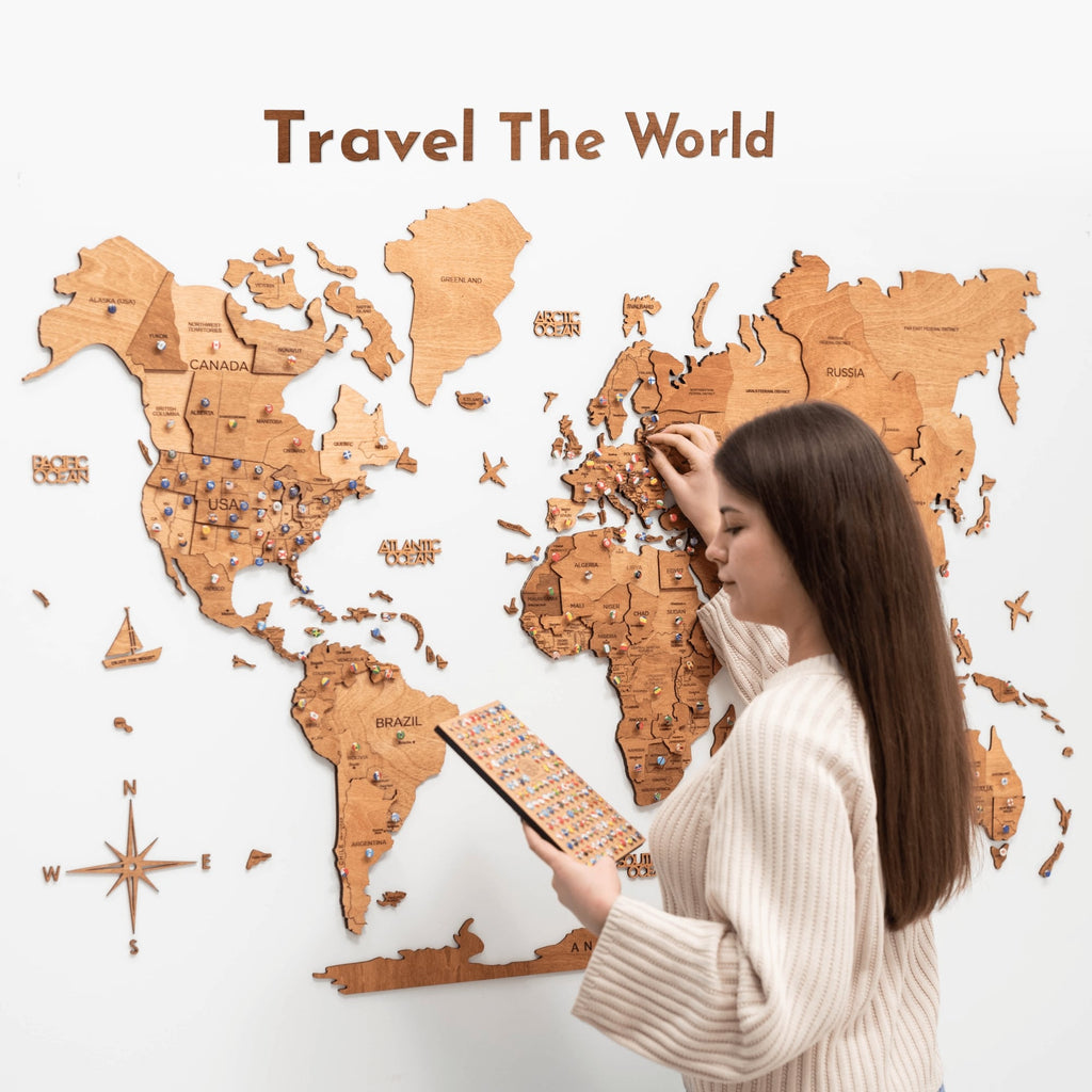 Wooden Map Quote Sign in Oak finish displayed next to a travel map