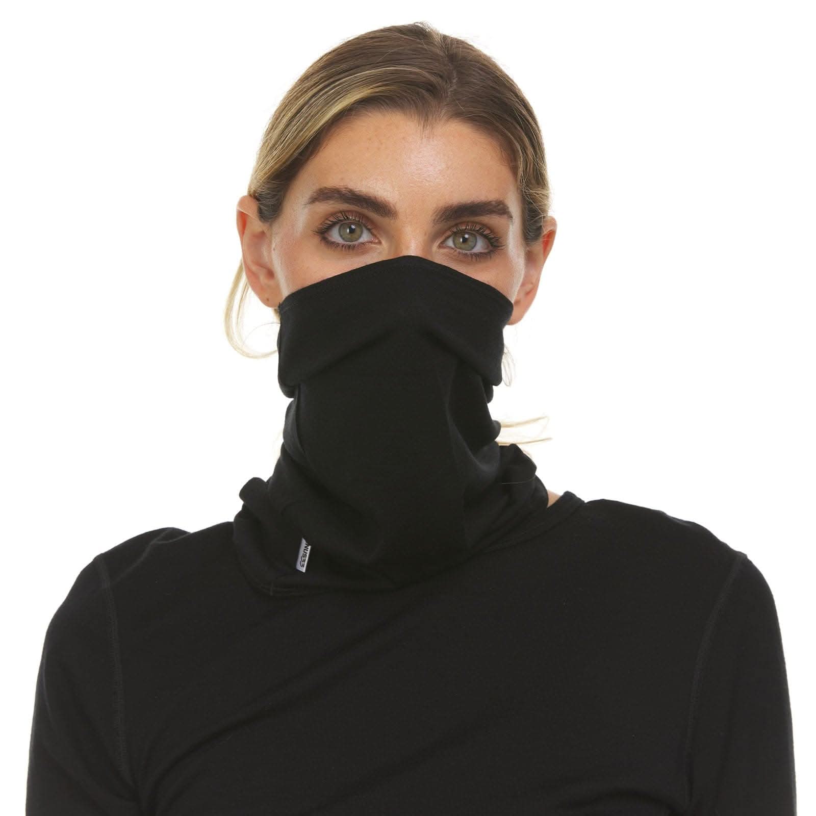 A solid black, lightweight merino wool half neck gaiter worn as a protective, minimalist face and neck cover.