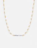 Modern gold Worthy Letter Necklace worn as a casual minimalist accessory.