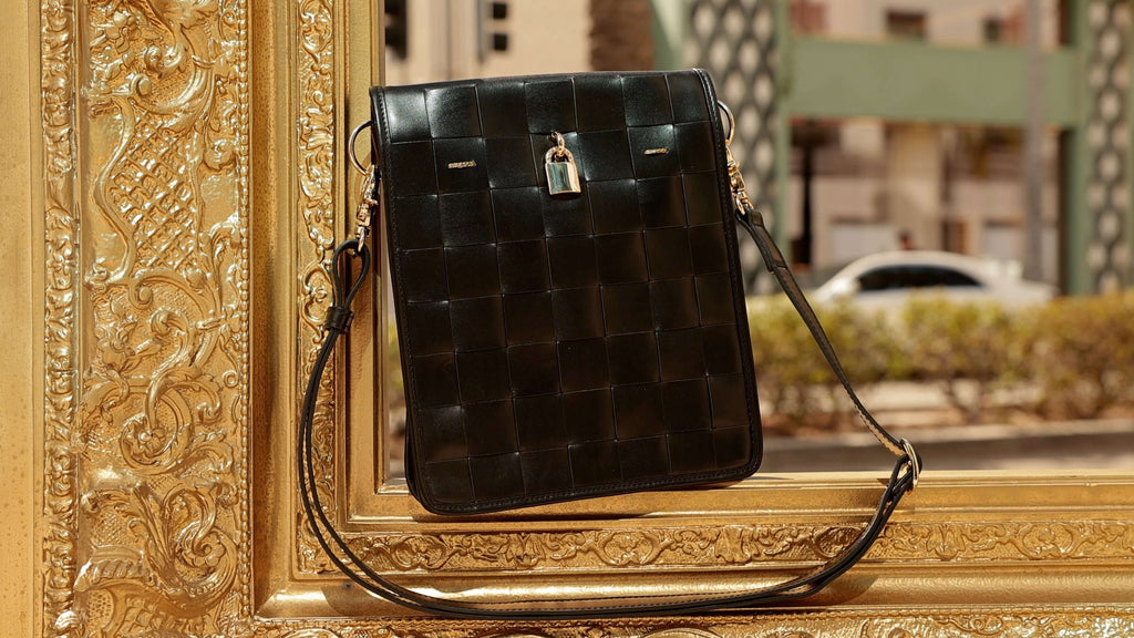 Woven Leather Crossbody Bag in Black with Signature Lock - Image 4