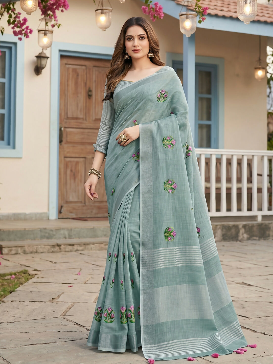 Sea green linen saree made from breathable fabric with matching blouse.