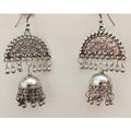Silver oxidized half moon jhumka earrings with hanging white pearl tassels.