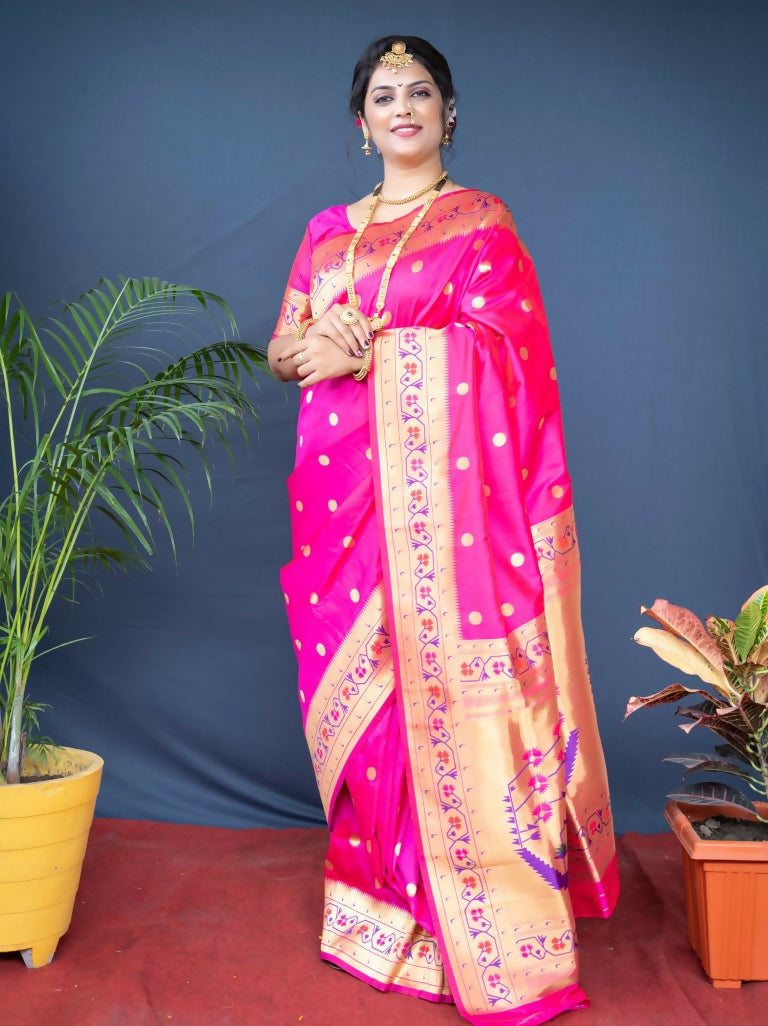 Elegant pink Paithani silk saree with detailed Zari woven work, paired with a matching pink blouse.