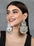Silver tone handcrafted earrings with Ghungroo style elements and embedded sparkling stones.