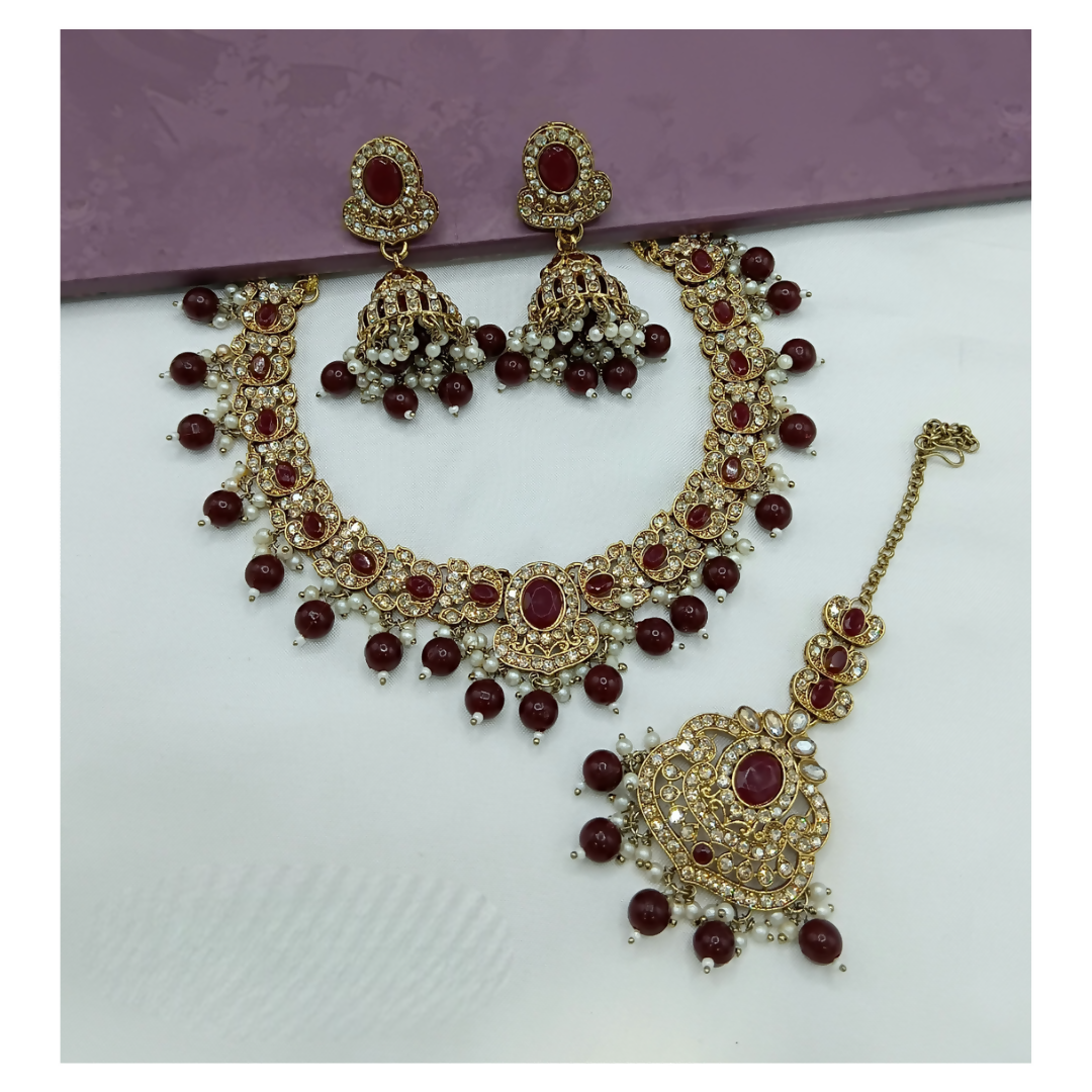 Elegant maroon stone work necklace set with matching earrings