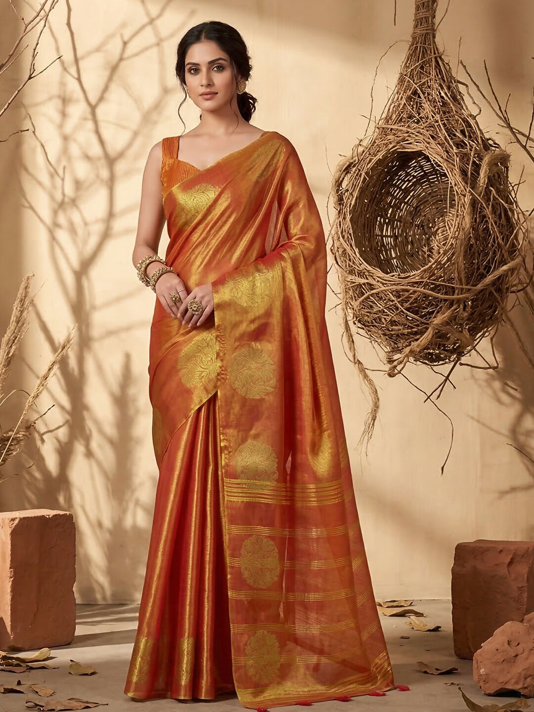 Rust colored tissue silk saree with natural metallic sheen