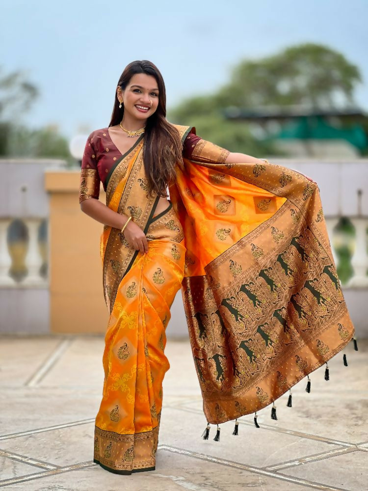 Mustard Orange Banarasi Silk Saree with detailed Zari weaving and Meenakari work