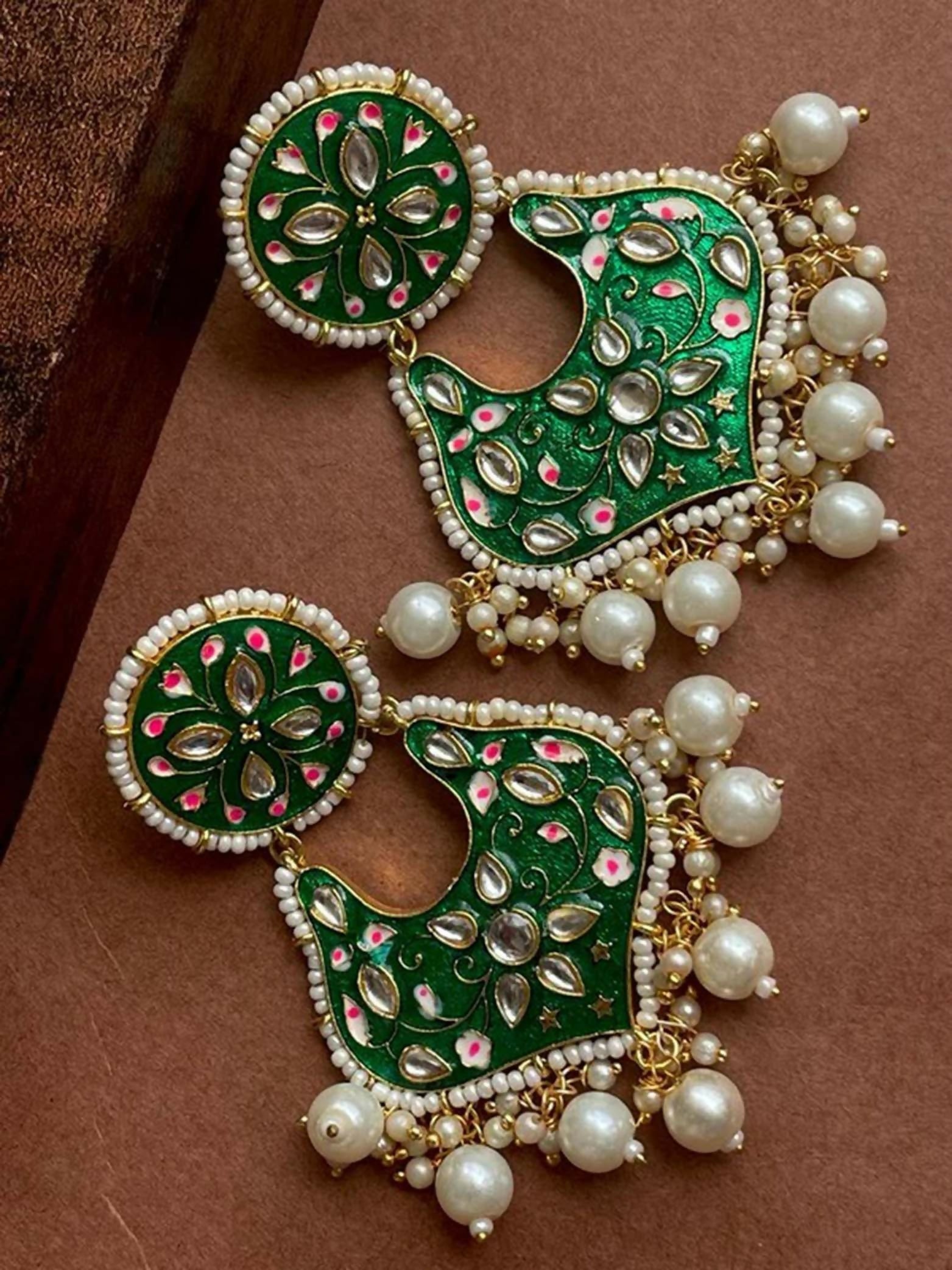 Green Meenakari earrings with intricate stone work and decorative beads in brass.