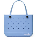 Extra Large EVA tote in Carolina on My Mind Blue standing on a sandy beach