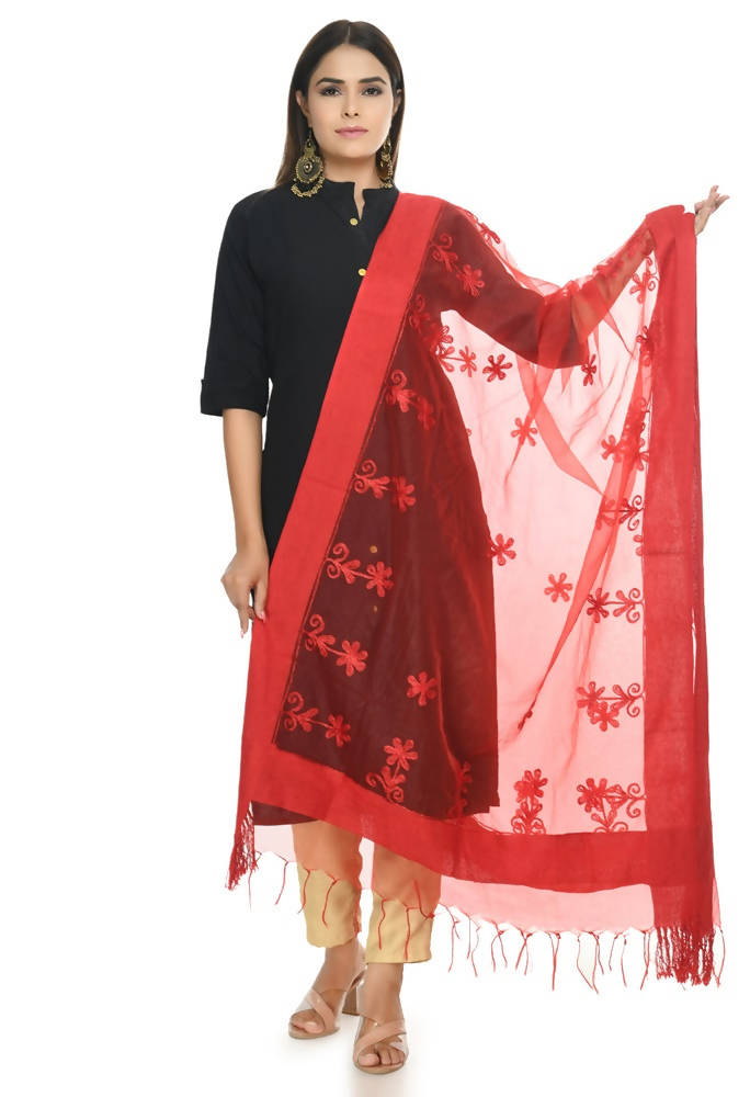 Close-up of red Orgenza fabric featuring delicate white chikan embroidery
