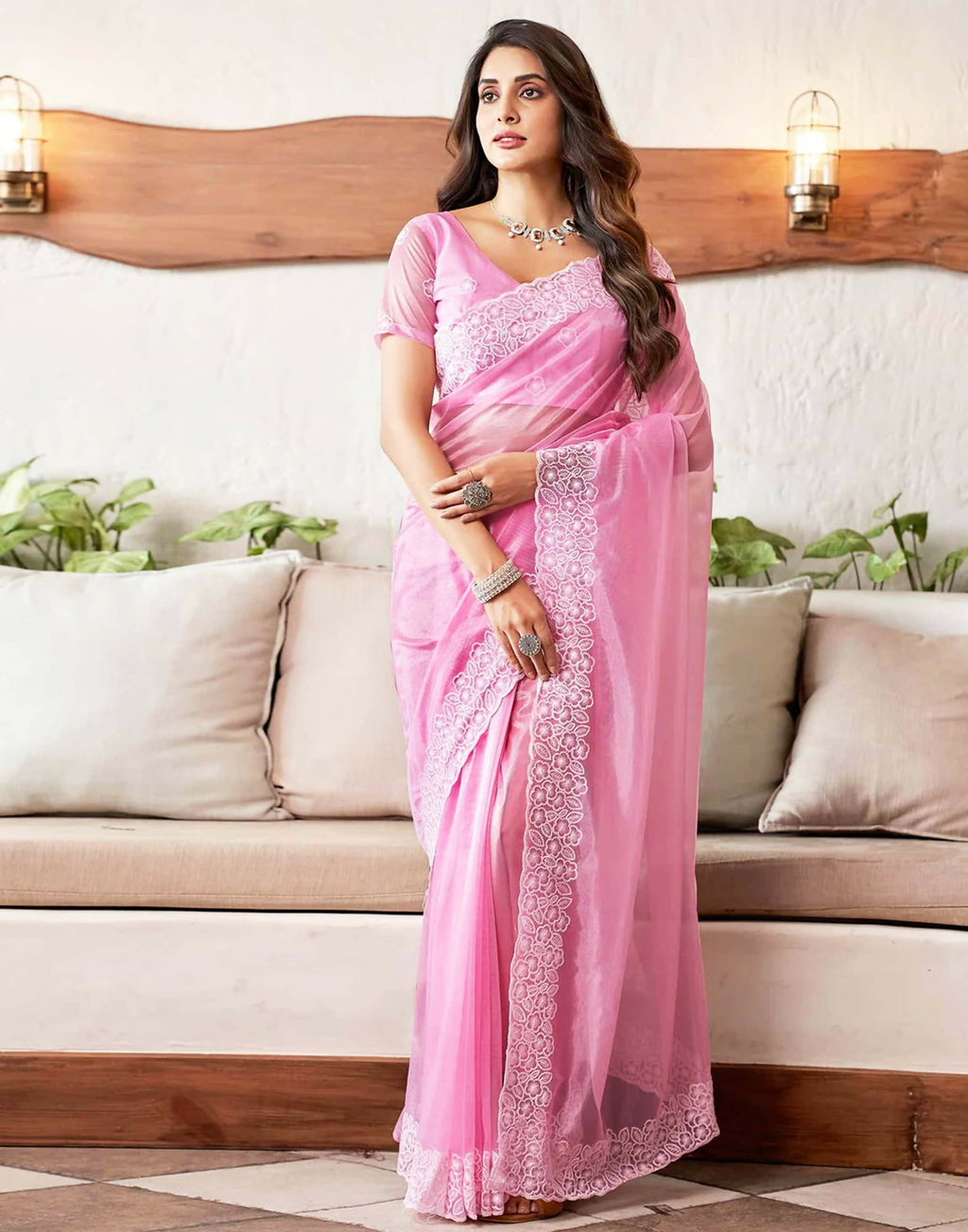 Pink and white organza saree with an elegant embroidery border