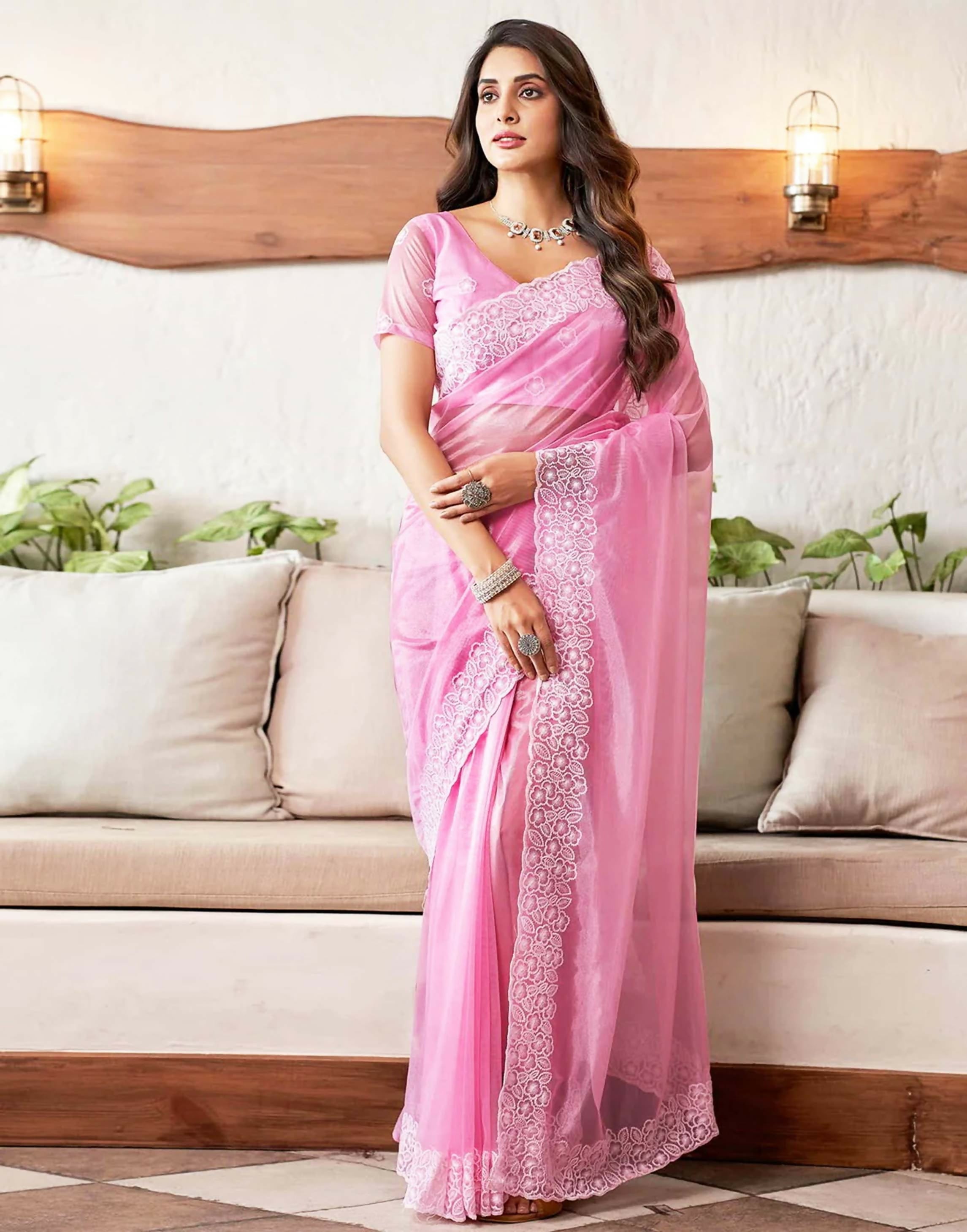 Pink and white organza saree with an elegant embroidery border