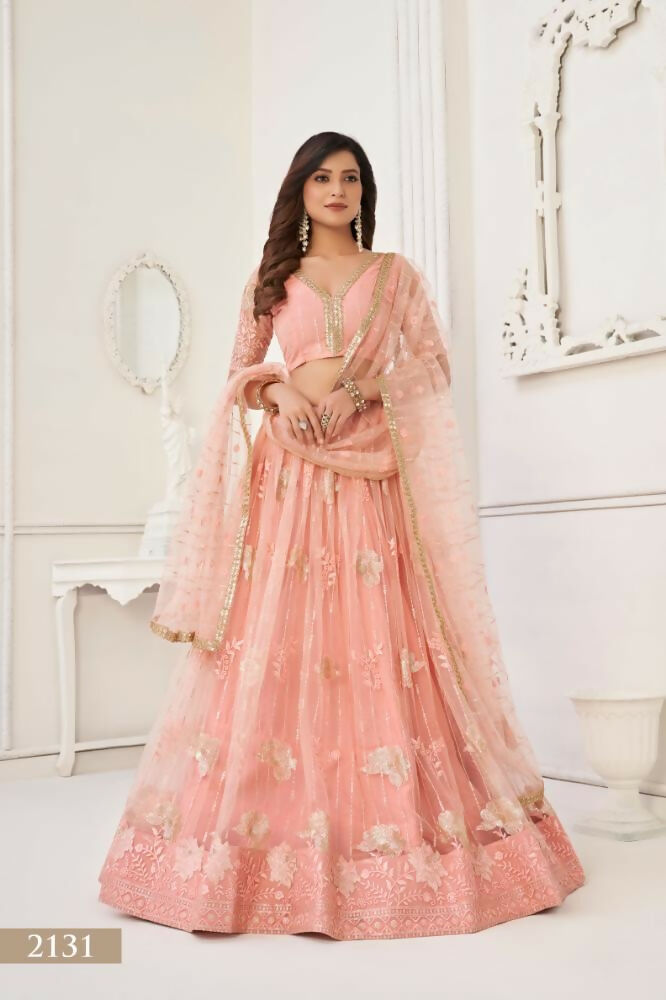Peach butterfly net lehenga featuring delicate tone-on-tone thread and sequence work