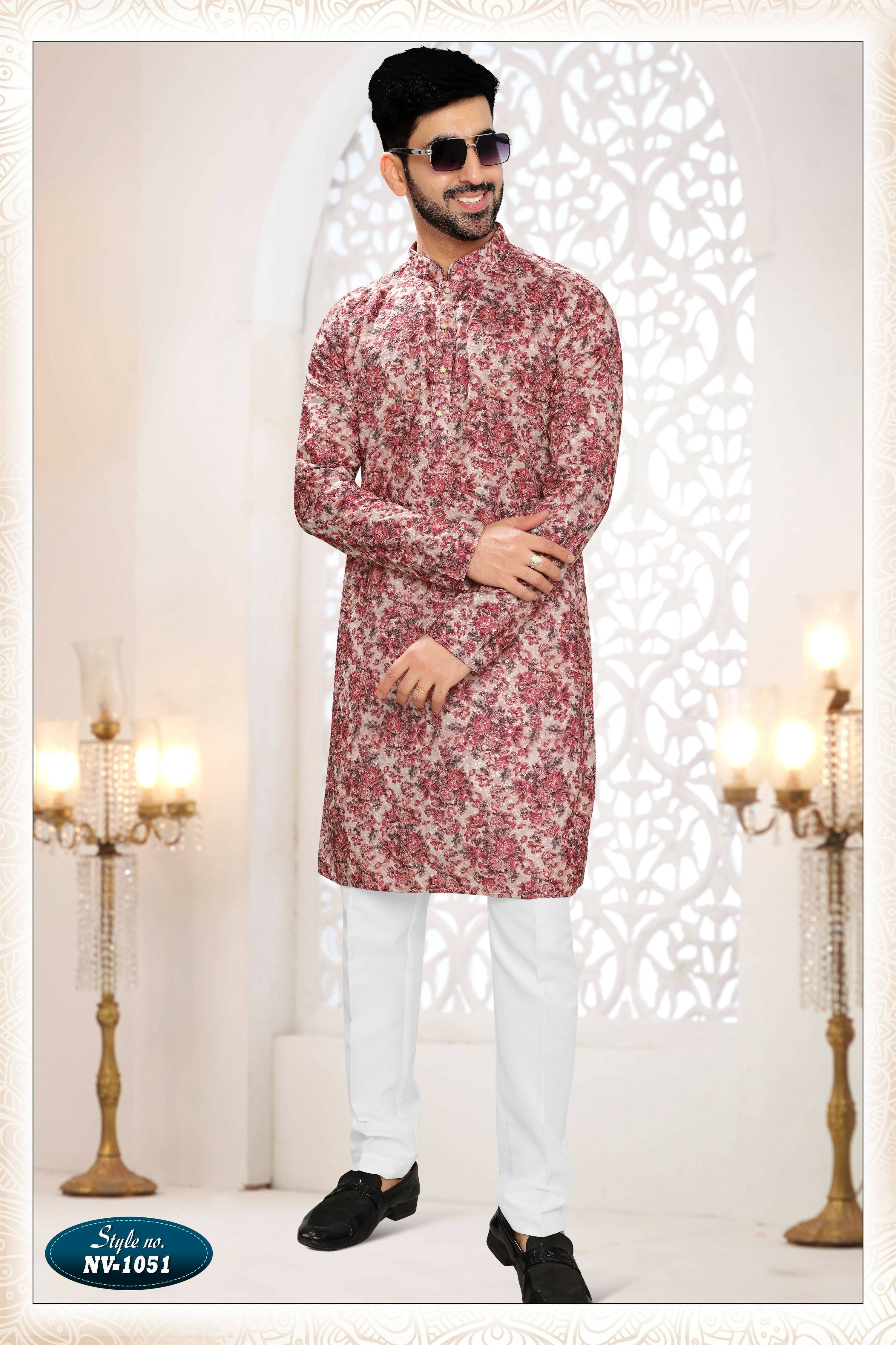 A stylish pinkish red rayon kurta for men with intricate all-over thread embroidery.