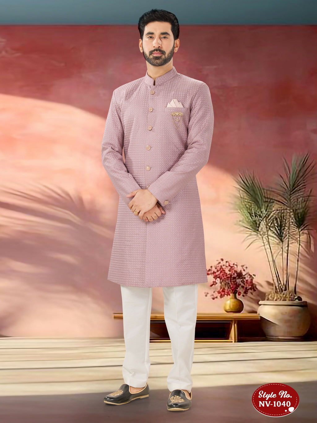 A men's pink silk Indo-Western kurta set featuring intricate thread embroidery and sequence work.