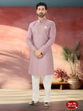 A men's pink silk Indo-Western kurta set featuring intricate thread embroidery and sequence work.