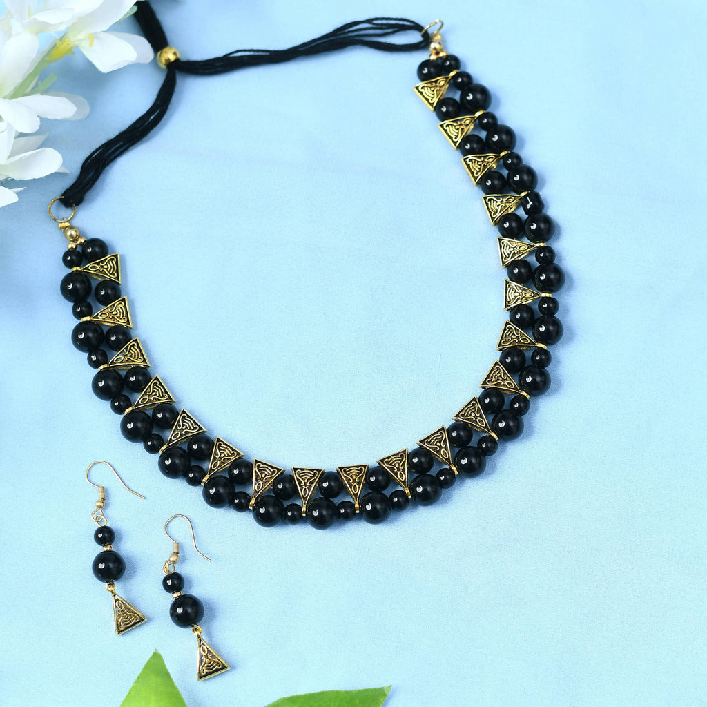Gold-polished brass choker with pearl and stone work in black and gold