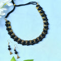 Gold-polished brass choker with pearl and stone work in black and gold
