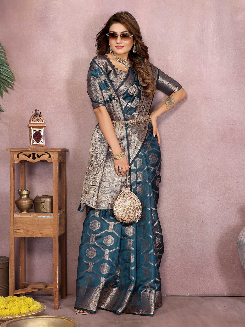 Teal Soft Organza Silk Saree with Intricate Weaving Detail