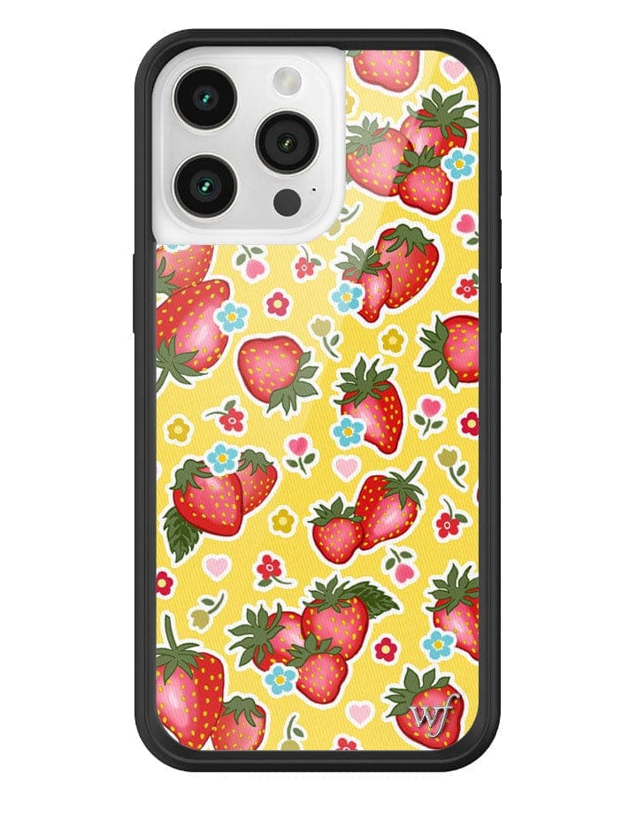 iPhone case featuring a yellow background with red strawberries and small blue and red floral accents in a sticker-inspired design
