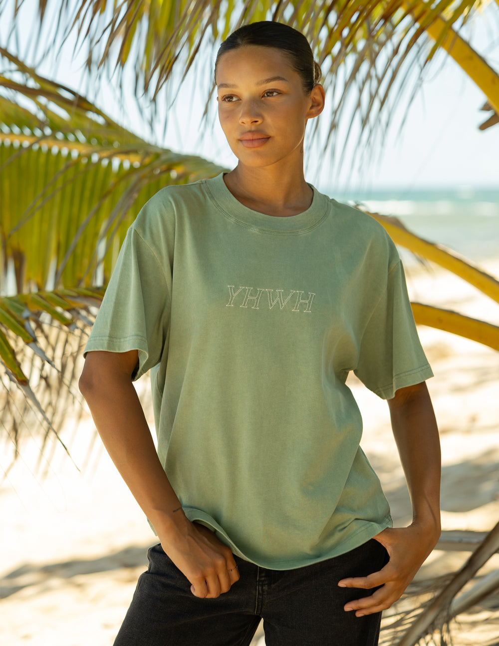 YHWH unisex graphic tee in sage green cotton with minimalist scripture design.