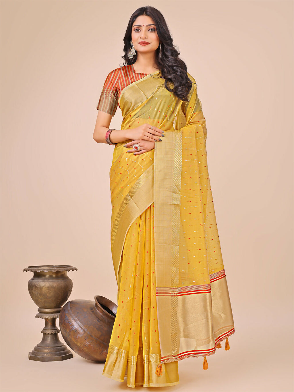 Beautiful yellow organza saree with matching blouse fabric for festive occasions.