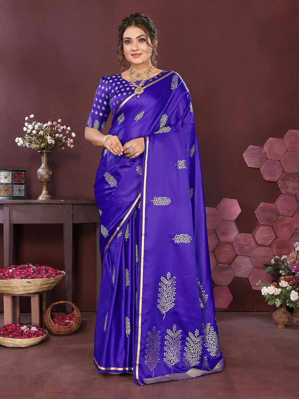 Deep blue satin silk Banarasi saree with detailed floral motifs and unstitched blouse