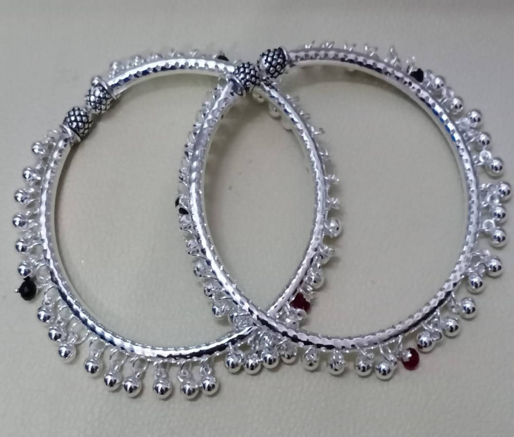 Elegant Rajasthani Hasli design anklets for women featuring silver, red, and black details.