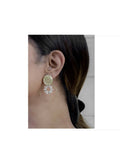A pair of elegant golden brass earrings featuring white AD stones for women