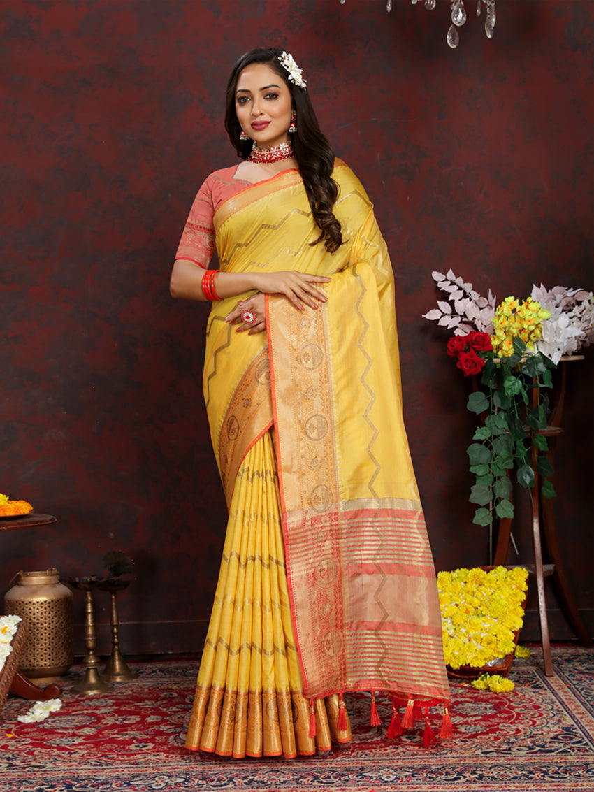 Yellow soft katan silk saree with an ornate gold Zari woven pallu.