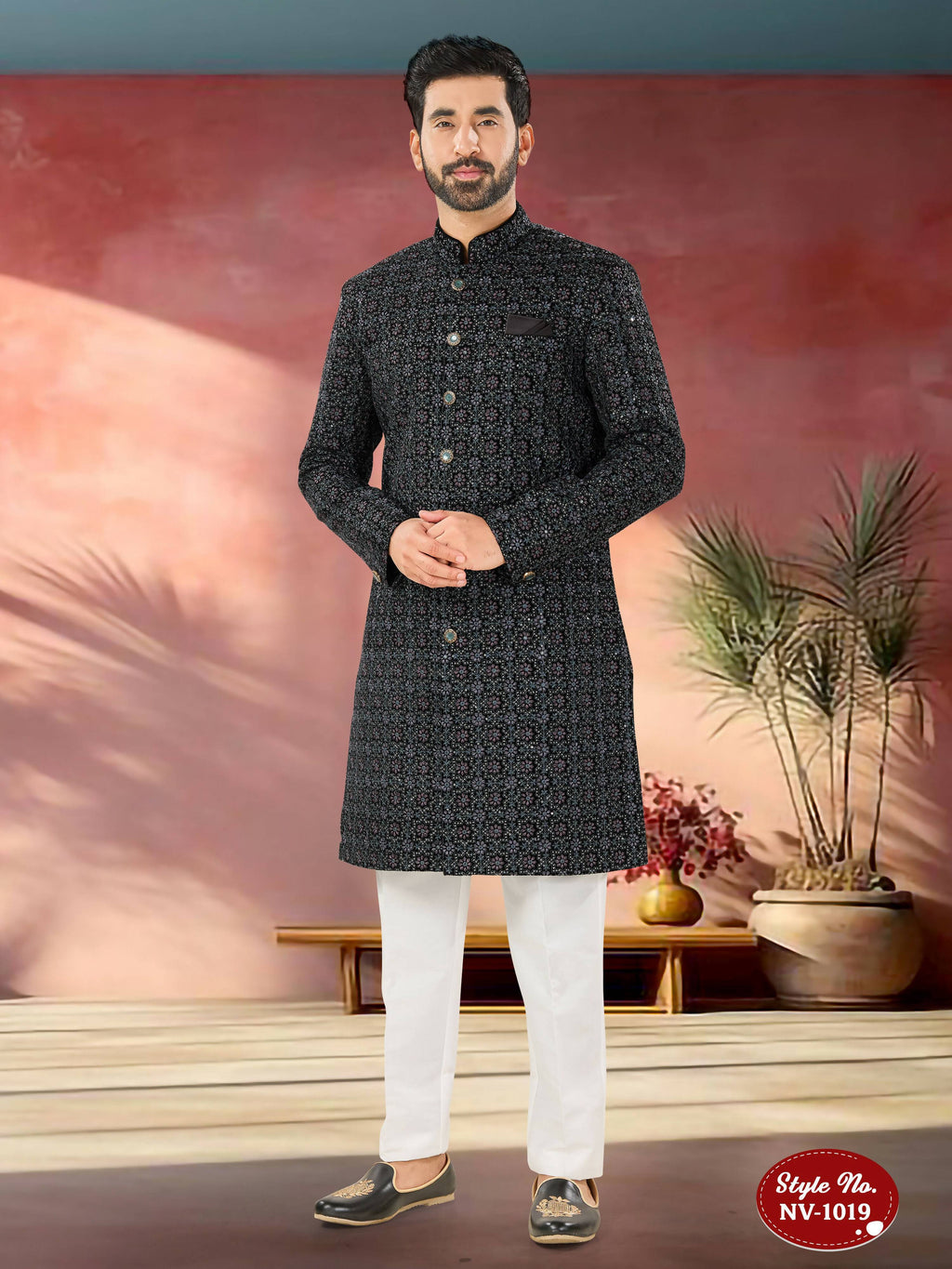 Men's blue velvet kurta with intricate sequence and thread embroidery details.
