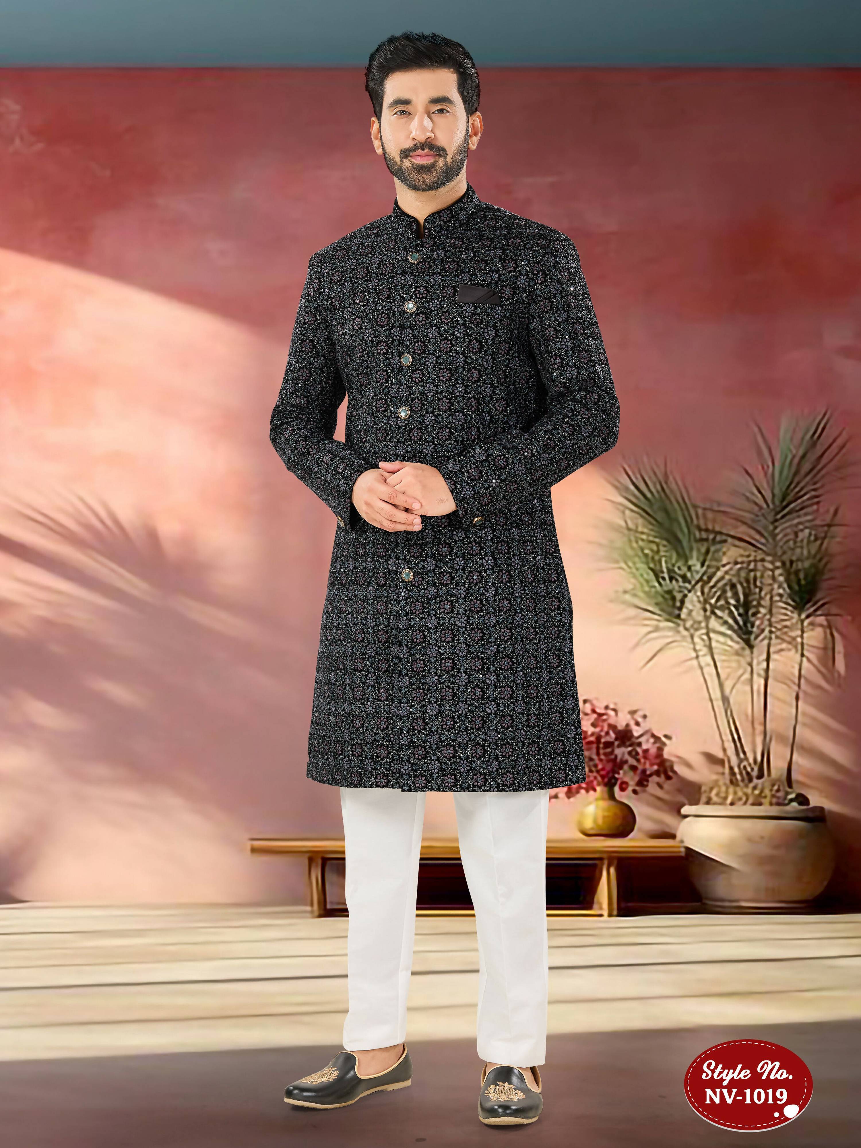 Men's blue velvet kurta with intricate sequence and thread embroidery details.