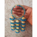 Trendy sky blue pearl bangles with hanging gold jhumkas