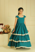 A young girl wearing an elegant green off-shoulder flared georgette maxi dress for a formal event.