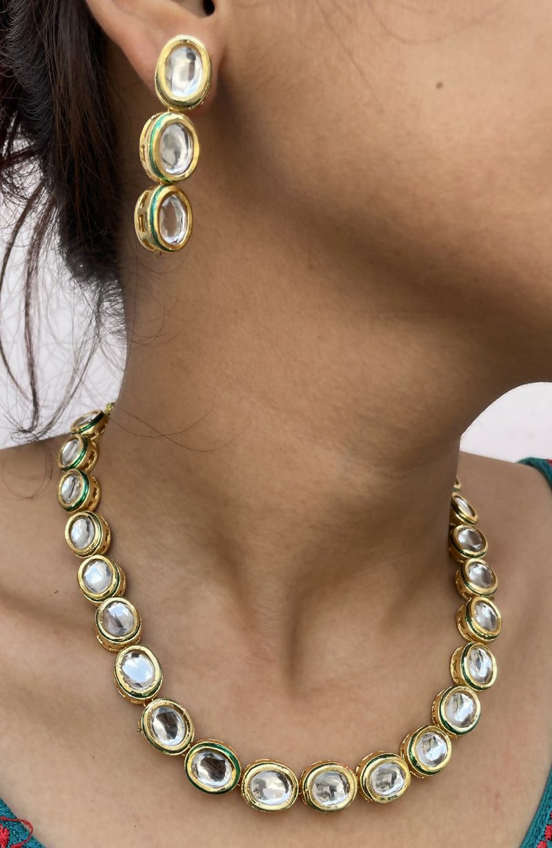 Elegant gold-plated Kundan necklace set isolated on a white background