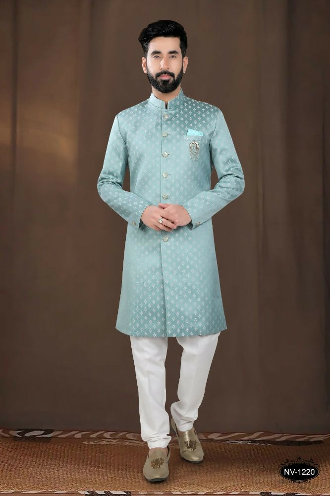 Toddler boy wearing a green woven jacquard kurta with matching pyjama set