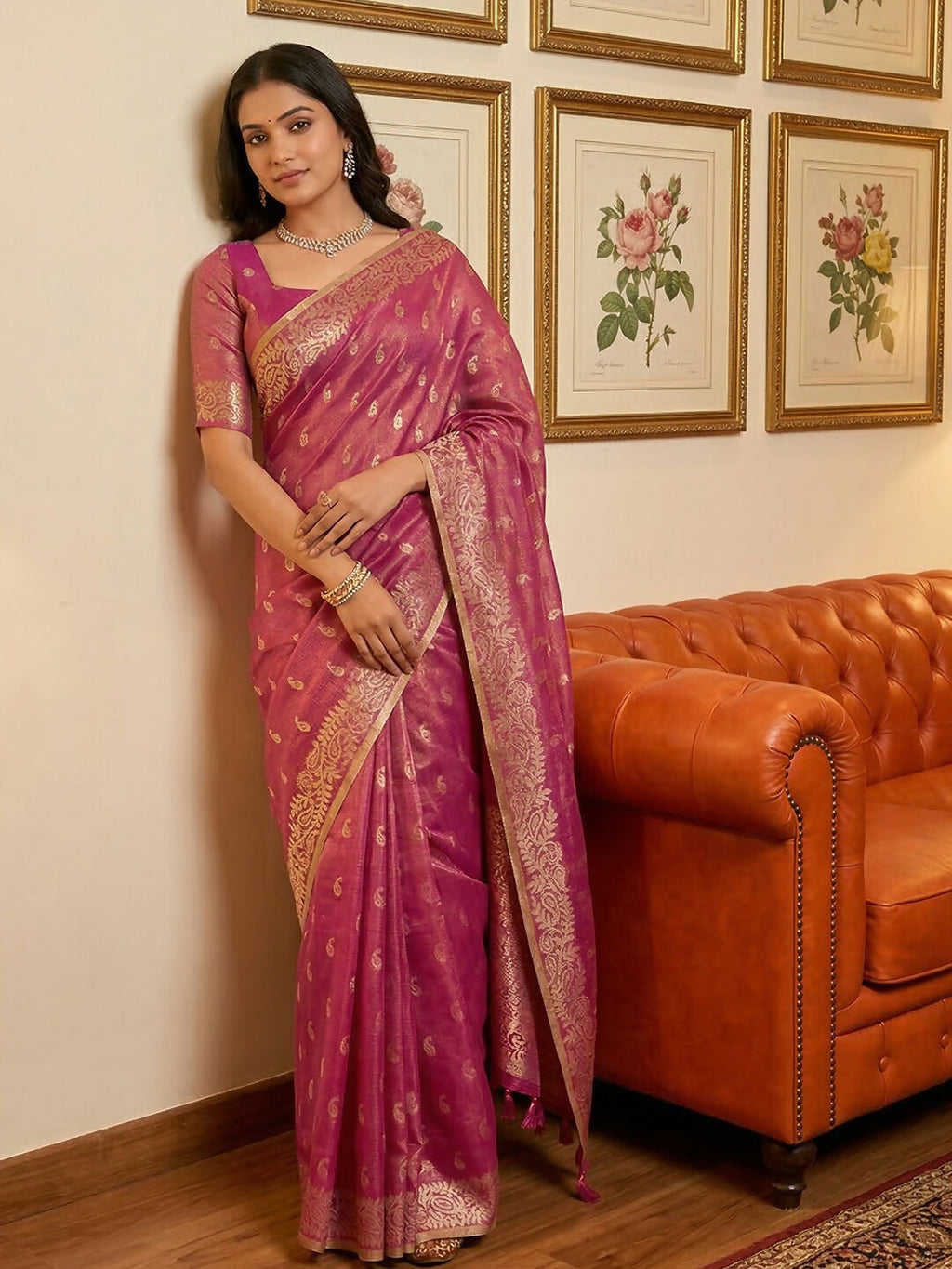 A beautiful wine-colored tissue silk saree with a matching blouse, elegant fabric texture.