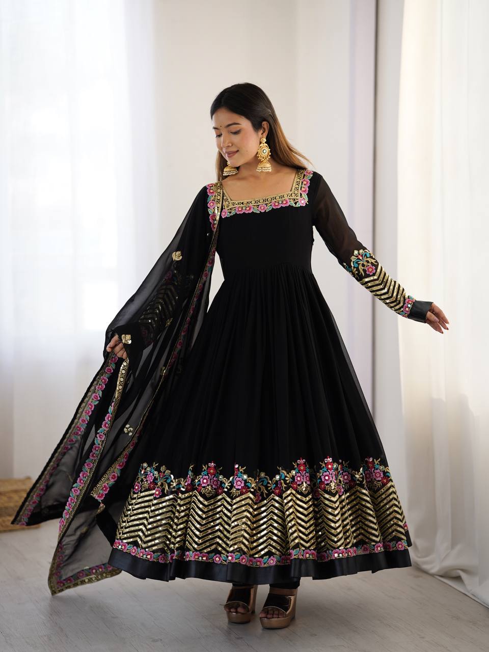 Black georgette Anarkali suit with heavy sequence embroidery and full sleeves.