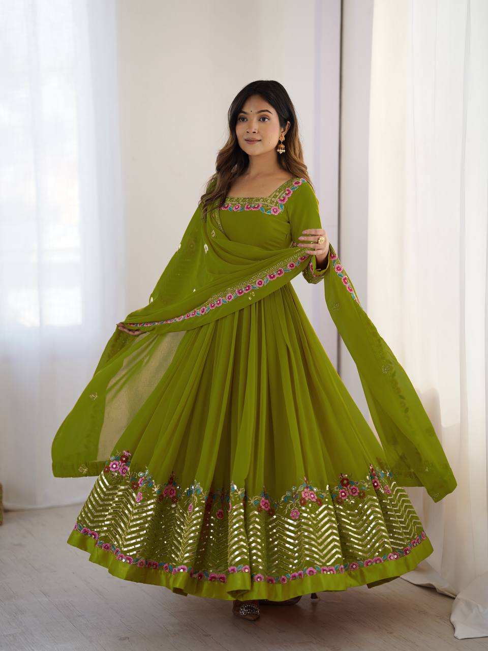 Parrot green heavy georgette Anarkali gown featuring multi-thread 5mm embroidery and sequence work.