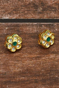 Traditional golden Kundan brass earrings with white and green embellishments